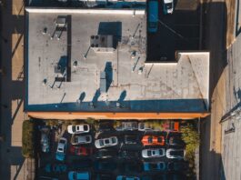 aerial view of urban parking lot with cars