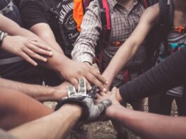 people doing group hand cheer